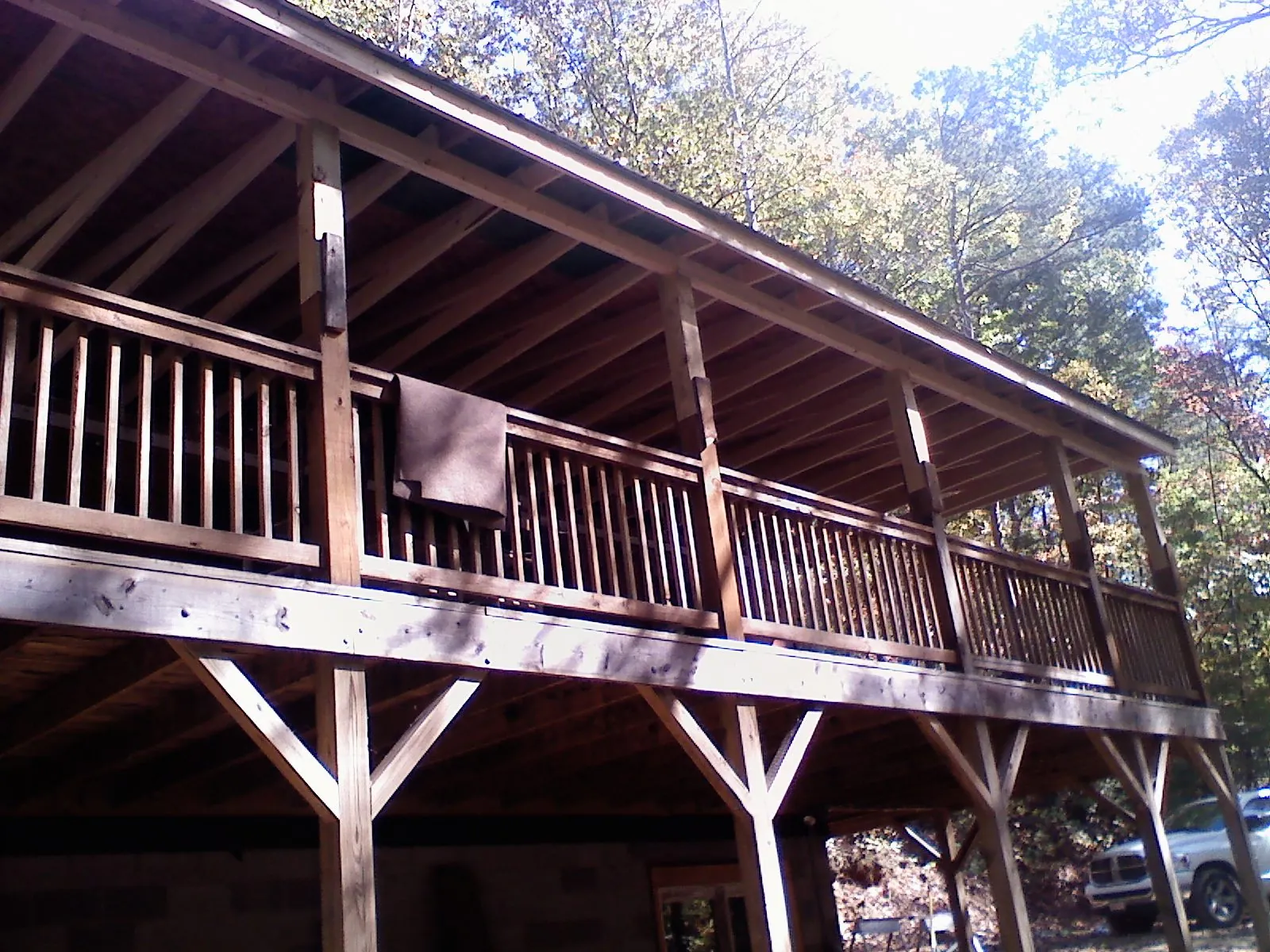 Timber framing under a new elevated porch and deck — Roof Leak Repair in Lincolnville by Roofing Brothers